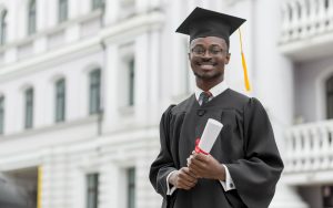 A young man following Credit Card Tips for Recent Graduates.