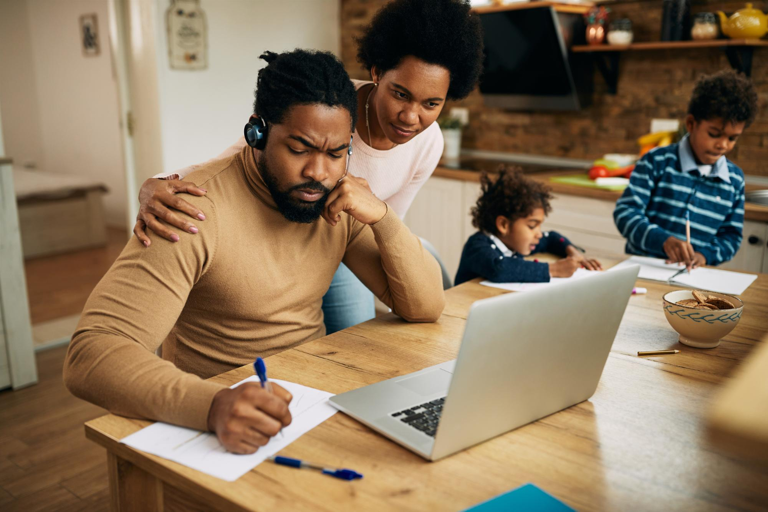 Father and mother creating a Family Budget.