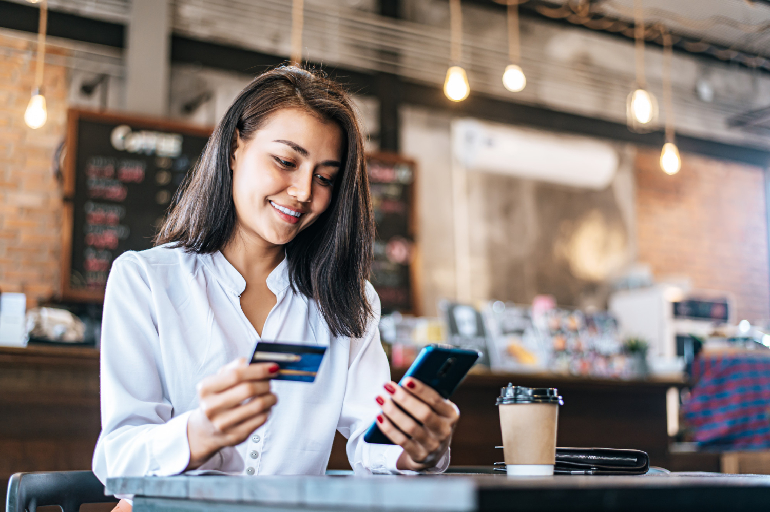 Woman learning facts about credit cards for use it.