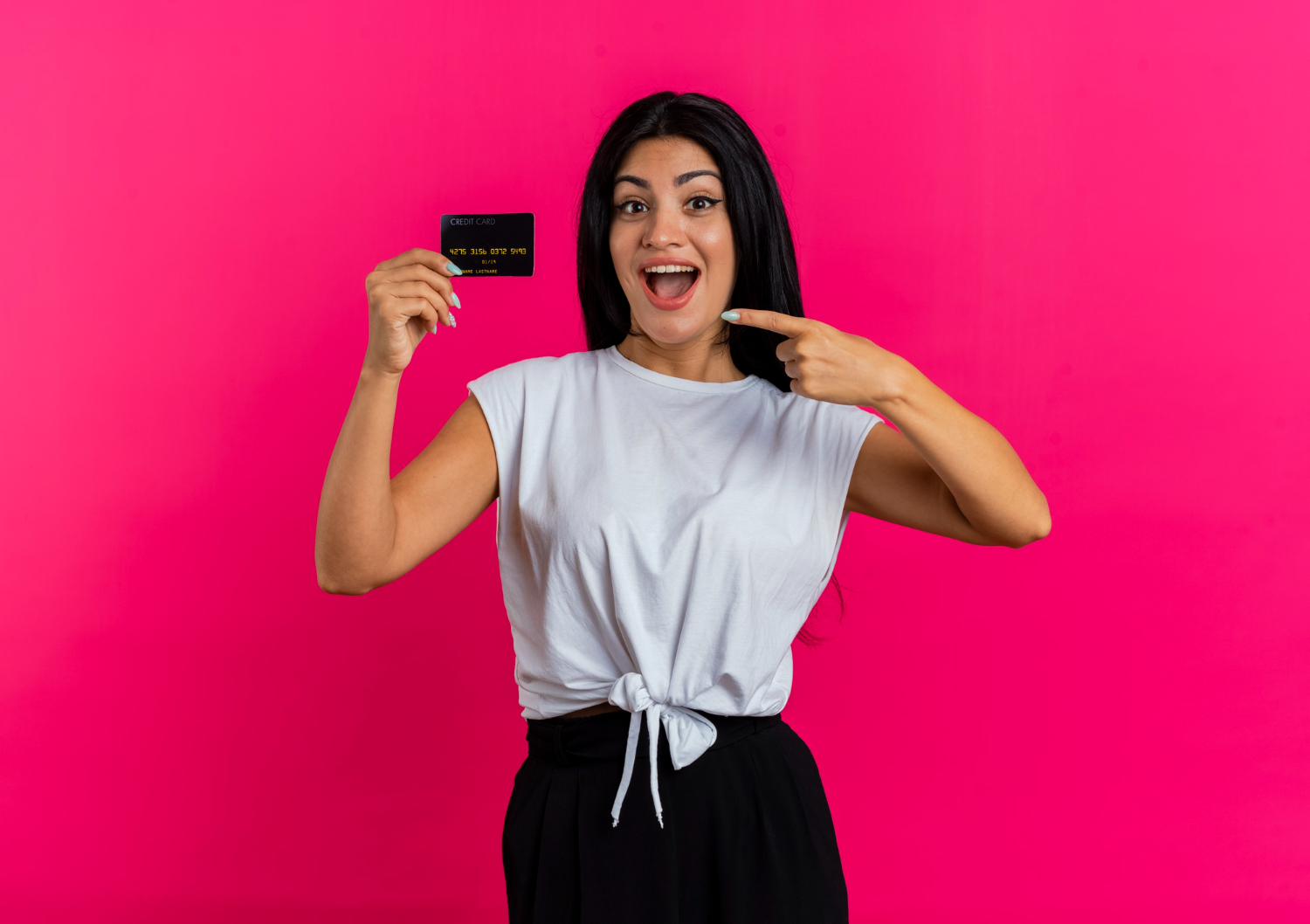 Woman holding her aeroplan credit card.