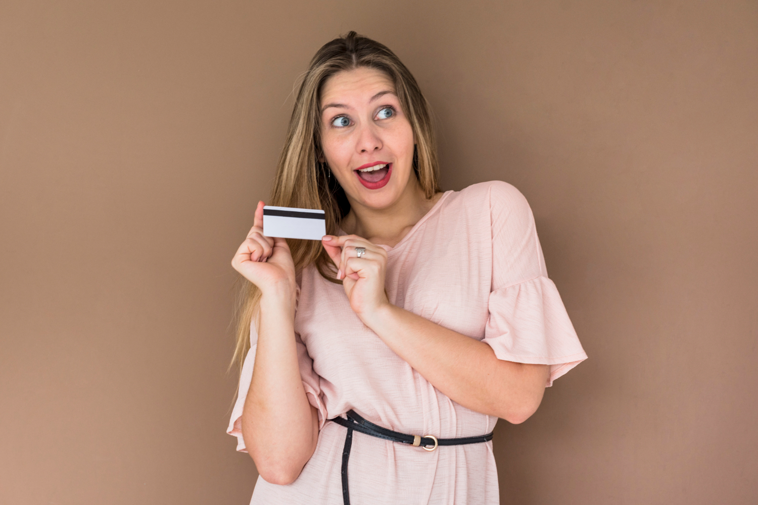 Woman happy with her CareCredit Card.