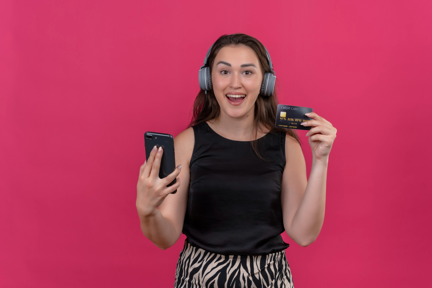 Woman holding her Citi Diamond Preferred.