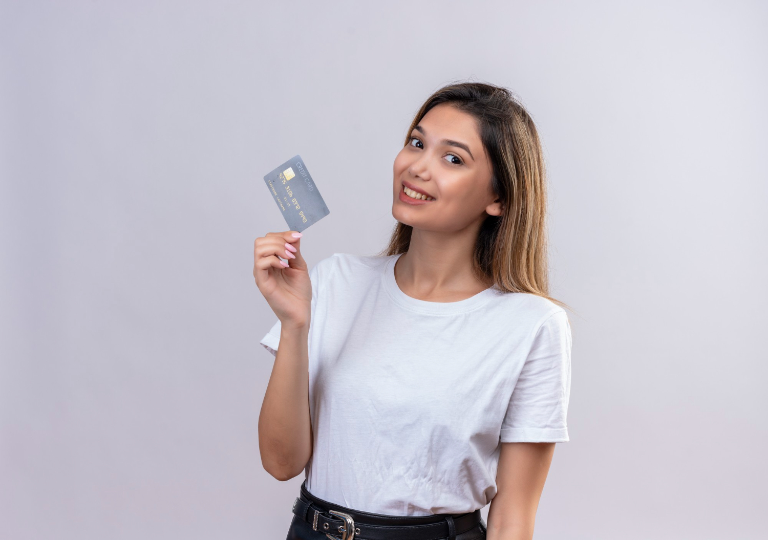 Woman holding her Citi Premier Card.