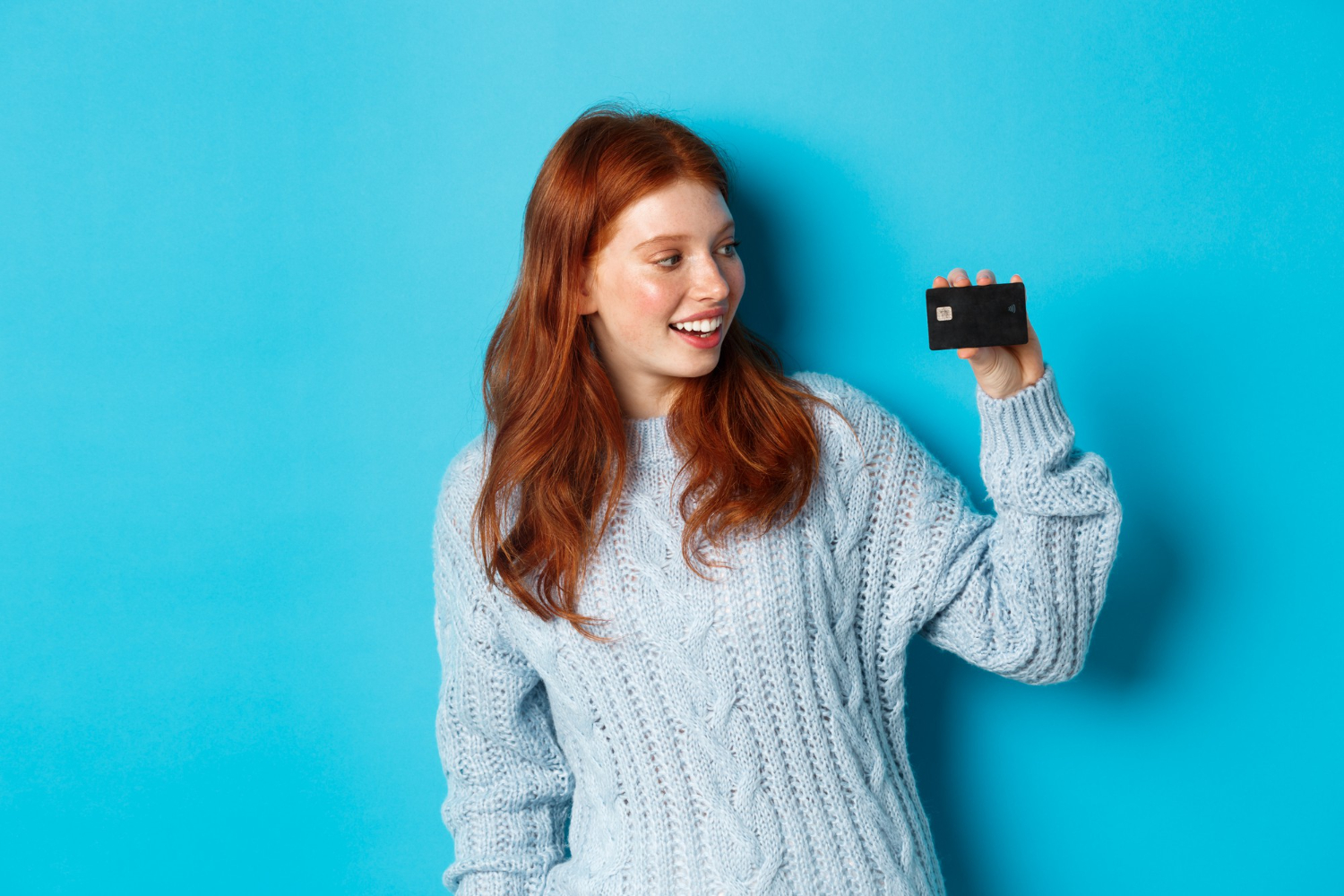 Woman holding her Discover it Balance Transfer