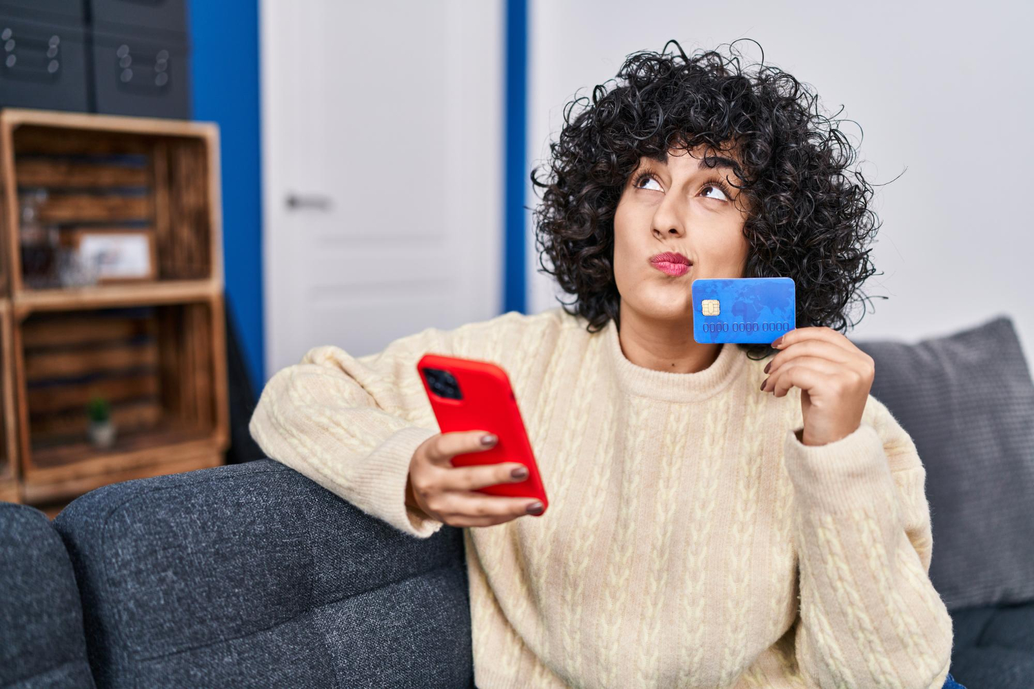 A woman using her Discover it Cash Back Credit Card.