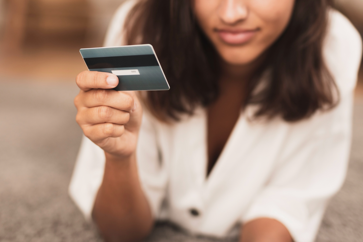 Woman using her Discover it Secured card.