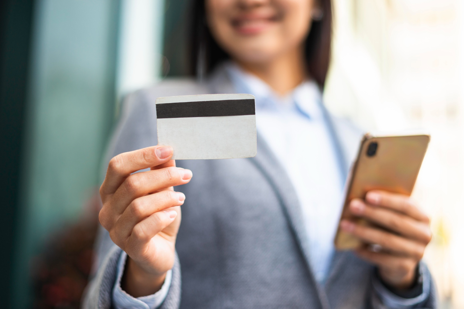 Woman holding her Southwest Rapid Rewards credit card.