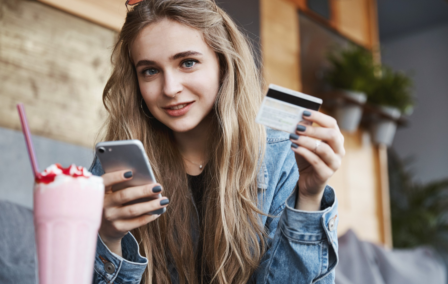 A happy woman knowing How a Credit Card Works.