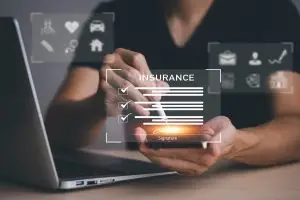 A person dealing with Denied Insurance Claims Surge.