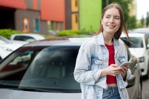 A girl using Teen Driver Insurance Discounts.