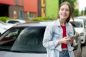 A girl using Teen Driver Insurance Discounts.